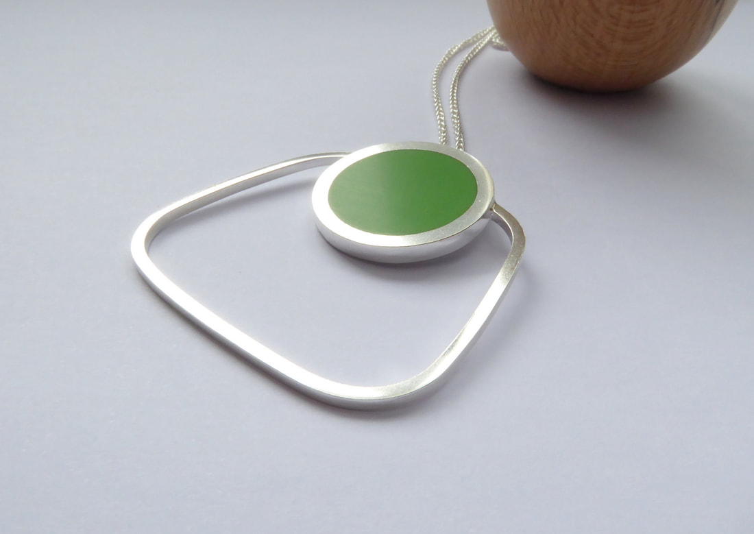 Picture of square staement pendant and chain in silver and green resin
